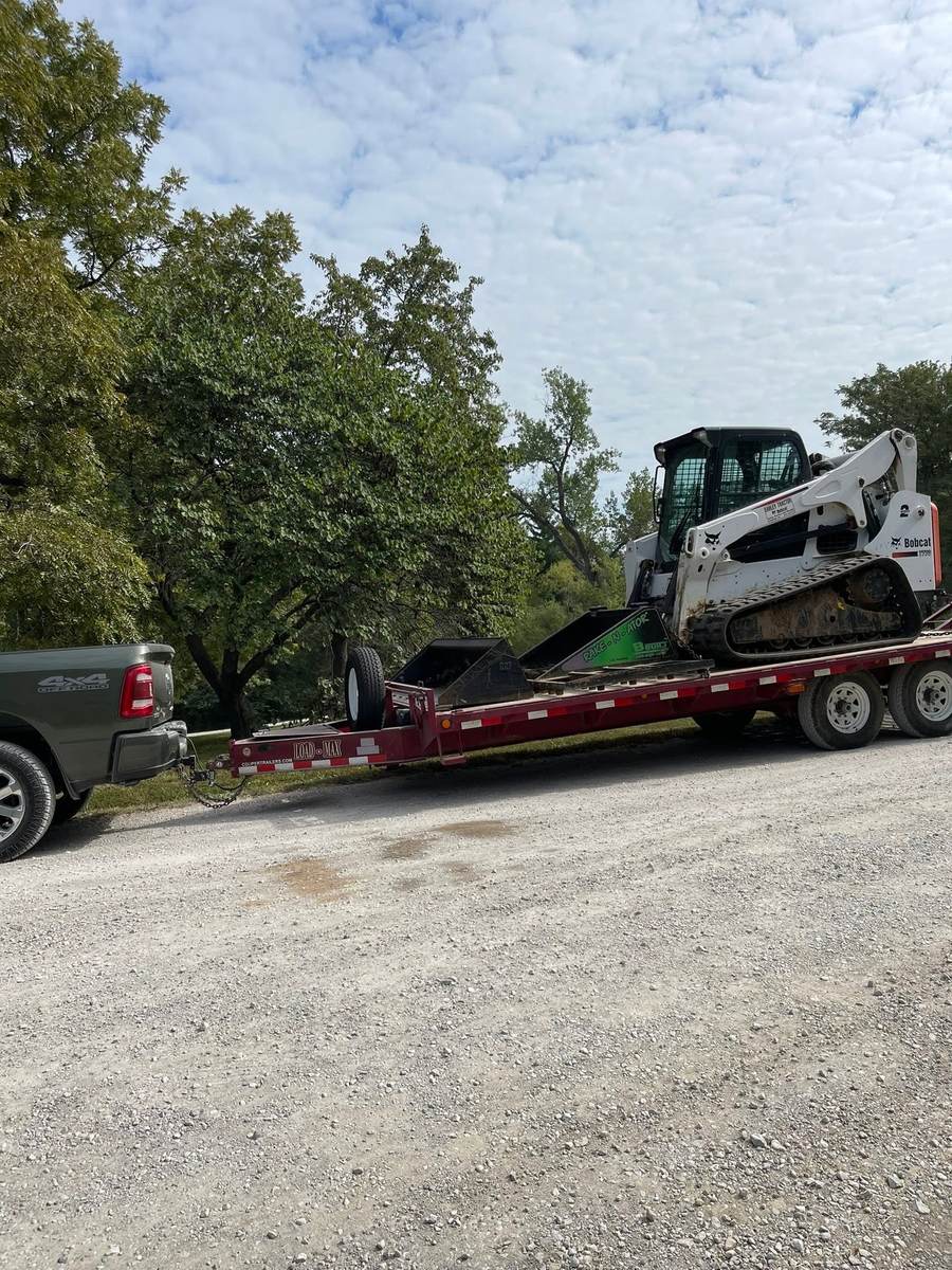 Roth & Sons truck, trailer and Bobcat