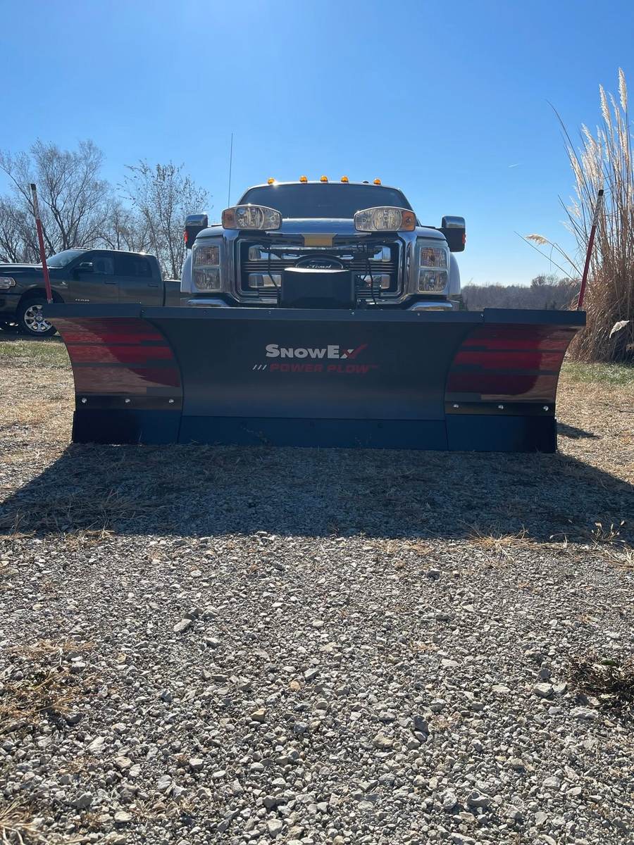 Snow plow equipped truck
